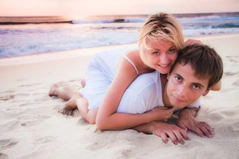 Couple lying on the beach Foto stock