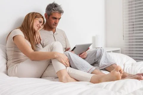 Couple lying in the bed 写真素材