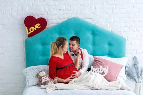 Couple lying on bed Stock Photos