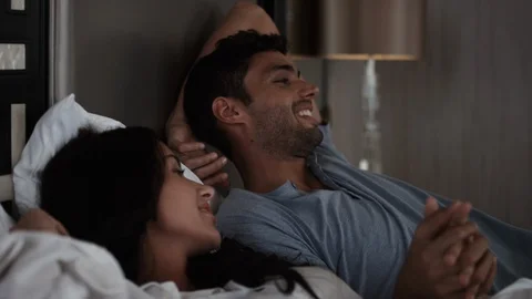 Couple lying in bedroom. Stock Footage 119384042
