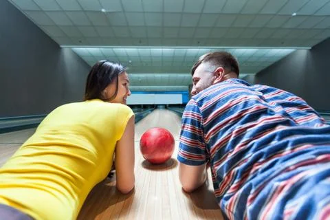 Couple lying on the floor Stock Photos