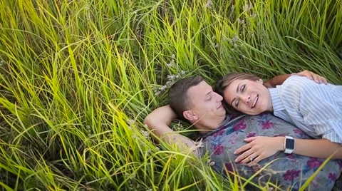 Couple lying in the grass Stock Footage 68355650