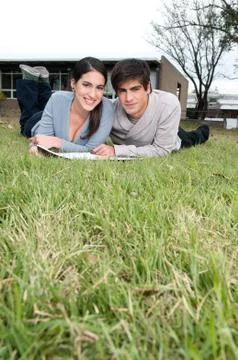 Couple lying on the grass Stock Photos