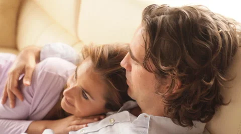 Couple lying on Sofa Stock Footage 43607336