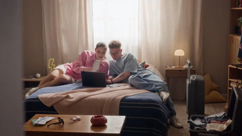 Couple Lying Together Planning Vacation on Laptop Computer Stock Footage 337555609