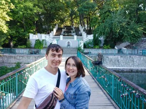 Couple make selfie with view of old steps in city park in Kamianets-Podilskyi Stock Photos