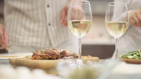 Couple is making dinner and drinking white wine . Stock Footage 78572101