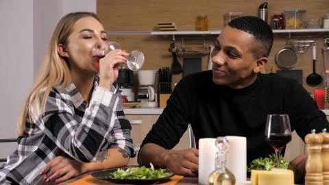 Couple making their conection even stronger while having a romantic dinner. Fotos Stock