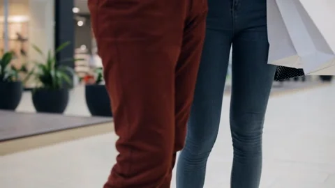 Couple in the mall in front of the showcase Stock Footage 96986420