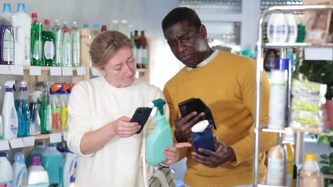 Couple man and woman scanning qr code for cleaning spray Stock Footage 309552353