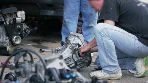 Couple of mechanics working car engine Stock Footage 30388441