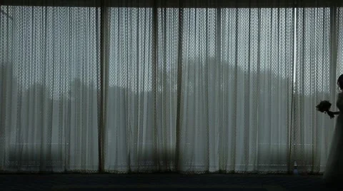 The couple meet on the background of the window. Urban view. Silhouettes of peop Stock Footage 65331849