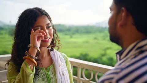 Couple Meets on Balcony Sharing affectionate Eye Contact Stock Footage 305956988