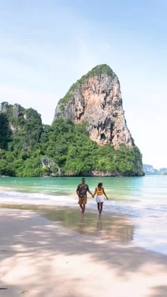 Railay Beach Krabi Thailand, a couple of men and woman on the