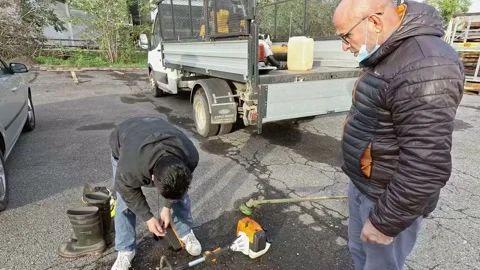 A Couple of Men Checking Machinery for Working While Wearing a Medical Masks Stock Footage 143192386