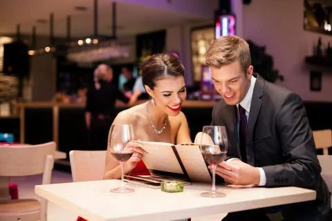 Couple with menu card Stock Photos