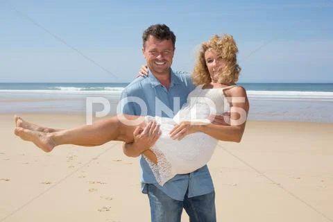 Couple middle aged romance beach love island concept Stock Photos