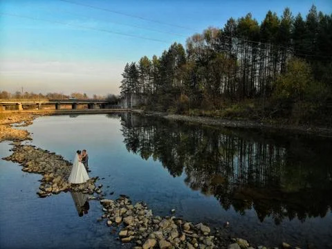 A couple in the middle of the river Stock Photos