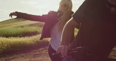 Couple on Motorcycle Watching the Sunset Stock Footage 83639545