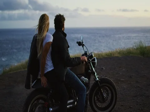 Couple on Motorcycle Watching the Sunset Stock Footage 83654002