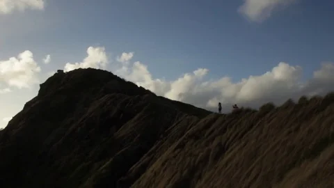 Couple on Mountain in Front of Clouds Stock Footage 73148857