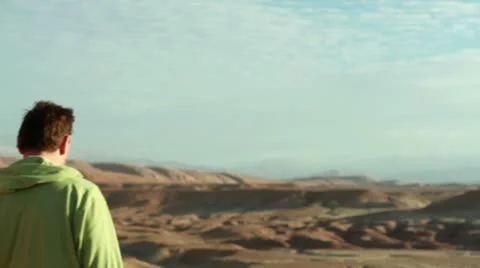 Couple in the mountains looking at landscape Stockbeeldmateriaal 10834678