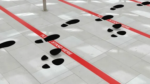 Couple moves in the queue and stops before red line on the floor in the airport Stock Footage 135120734