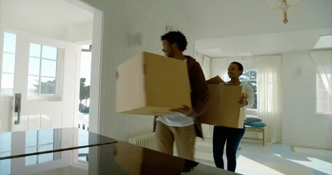 Couple moving boxes out of their house on moving day. Stock-Footage 88373600
