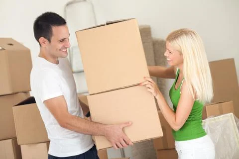 Couple moving boxes Stock Photos