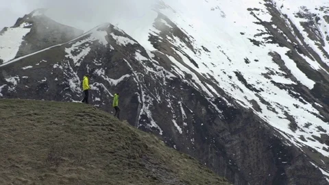 Couple moving down a mountain Stock Footage 72508592