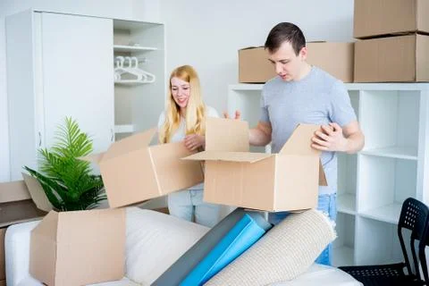 Couple moving into new house Stock Photos