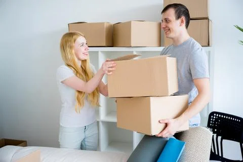 Couple moving into new house Stock Photos