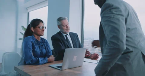 Couple of multi-ethnic managers looking through CV Stock Footage 208043403