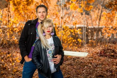 Couple is next to swing Stock Photos