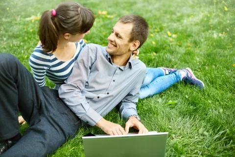 Couple with notebook Stock Photos
