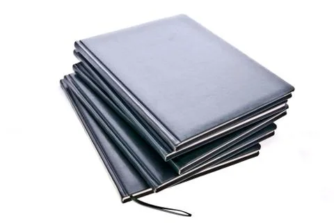 A couple of notebooks on white background Stock Photos