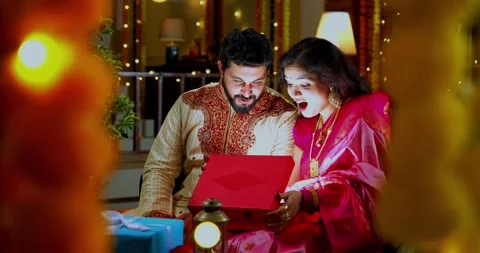 Couple Opening Glowing Gift Box Surprised with Light, Diwali Celebration Stock Footage 342380996