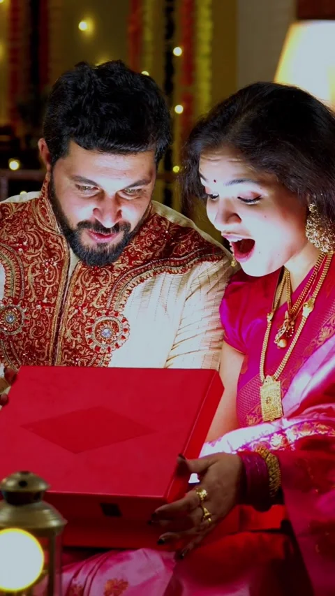 Couple Opening Glowing Gift Box Surprised with Light, Diwali Celebration Stock Footage 342381320