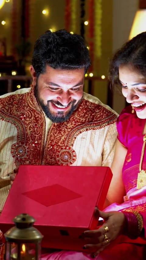 Couple Opening Glowing Gift Box Surprised with Light, Diwali Celebration Stock Footage 342381325
