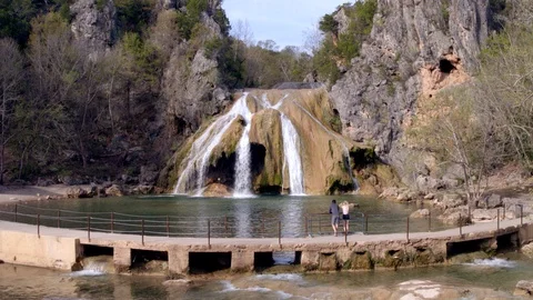 Couple Overlooking Waterfall from Trail Stock Footage 97125835