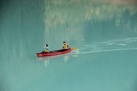 A couple paddling a canoe on Emerald Lake in Bristish Colombia. A couple p... Stock Photos