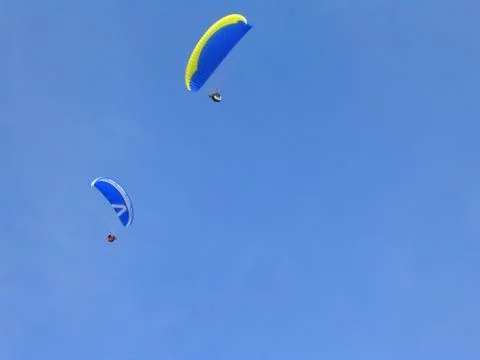 Couple of paragliders enjoying the views . Extreme sports. Stock Photos