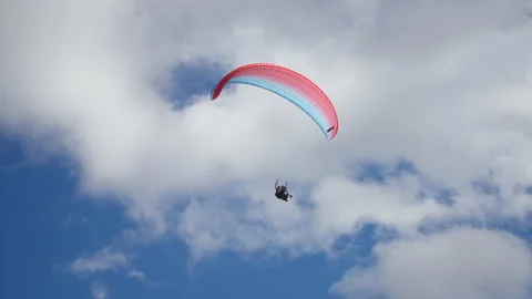 Couple paragliding between the clouds Video stock 196737915