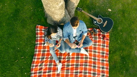 Couple in the park having fun with bubble blowers. Stock Footage 95435232
