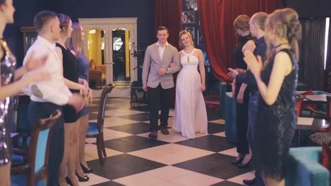 The couple passes through corridor formed by guests Stock Footage 75258342