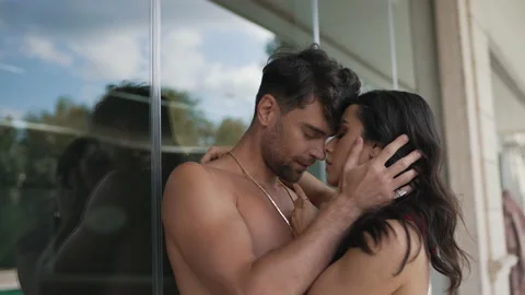 Couple passionately hugging on vacation Stock Footage 169887790
