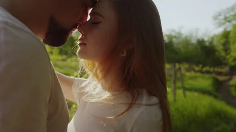 Couple with pensive faces standing close, closed eyes. Love and romantic concept Stock Footage 249737682