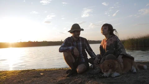 Couple of people with corgi Stock Footage 91602182