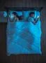 The couple with phone lie on the bed. night time. view from above Photo