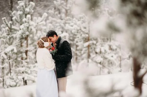Couple in a pine forest Foto stock